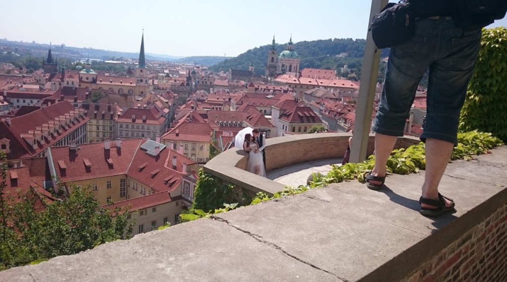 Random Married Couple at Prague Castle. I suddenly witnessed them and captured them as their wedding photographer did the same.